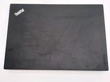 a black mouse pad with a sticker on it