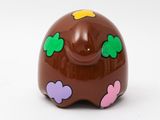a chocolate elephant that is decorated with hearts and clovers