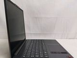 laptop computer sitting on a white surface with a white background