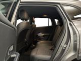a view of the back seat of a car with the door open
