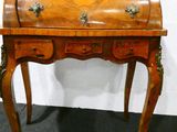 a small wooden desk with a drawer on top of it