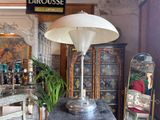 a lamp that is sitting on a table in a room