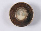 a picture of a woman in a picture frame on a plate