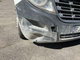 a car that has a dent in the front of it