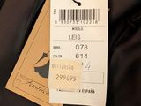 the label on the jacket is attached to the tag of the jacket