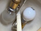 an image of a bathroom sink with a light bulb in it
