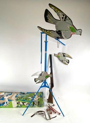 three birds that are on top of a stand