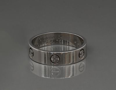 a close up of a silver ring with screws on it