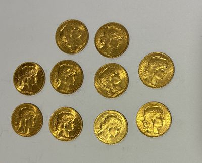 several gold coins are arranged in a circle on a white surface