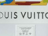 a picture of a louis vuitto sign on the wall