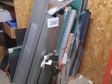 several pieces of metal are stacked up in a pile in a room