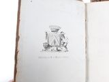 someone is holding a book with a drawing of a lion on it