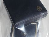 a small black box with a ring inside of it