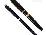 a close up of a pen and a ballpoint pen on a white background
