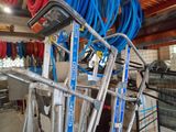 a lot of hoses that are hanging on a rack