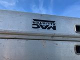 a white truck with a black and blue logo on it