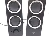 two speakers sitting next to each other on a table