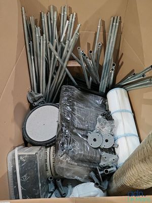 a cardboard box filled with assorted items and tools