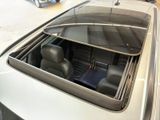 a car with a sunroof sitting in the back of it