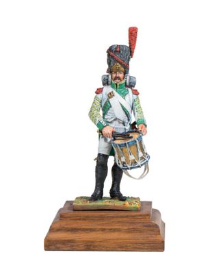 the toy soldier is holding a drum on a wooden base