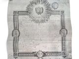 un vieux document sur lequel figurent un soleil et une étoile