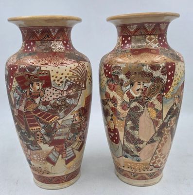 pair of asian vases with asian scenes on them on a white background