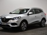 a silver renault suv parked in a room with a checkered floor