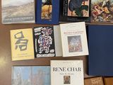 several books are sitting on a table next to each other