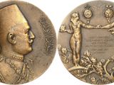 a close up of a medal with a man and woman on it