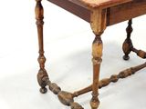 a small table with a wooden top on a white background