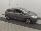 an image of a grey car parked in a garage