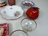 many different dishes and cups on the table