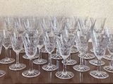 a lot of wine glasses sitting on a table