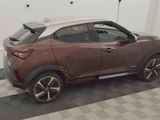 a car that is parked in a garage with a roof rack