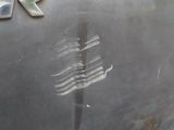 a close up of a car ' s emblem on the side of the car