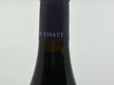 a bottle of wine that is sitting on a table