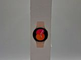 samsung galaxy watch in a white box with a red face