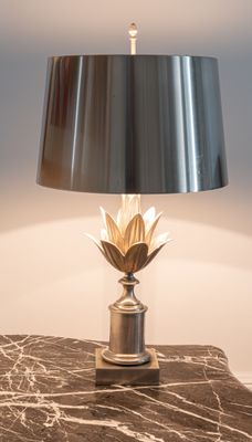 a lamp that is on top of a marble table