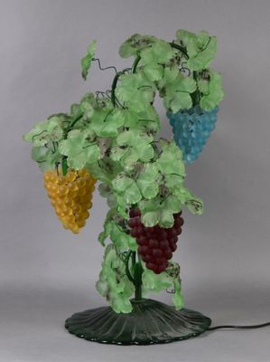 a lamp that has a bunch of grapes on it