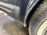 a close up of a car ' s tire with a hole in it