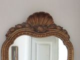 a mirror hanging on the wall in a room