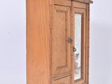 a small wooden cabinet with a mirror in it