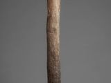an image of a wooden stick with a face on it