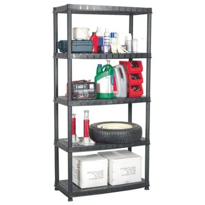 a black shelf with a tire and other items on it