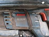 a close up of a bosch power tool in a car