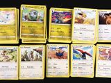 a lot of pokemon cards that are on the table