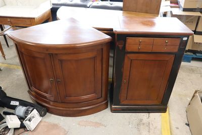 two cabinets that are sitting next to each other in a room