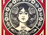 a red and black poster with a woman ' s face in the center