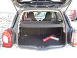 the back of a car with its trunk open and a red object in the trunk