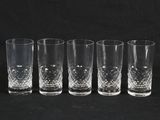 six glasses are lined up in a row on a black background